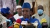 FILE - Leader of the M5 movement Choguel Kokalla Maiga, center, speaks to the press in Bamako, Mail, May 28 2021.