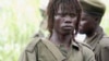 The leader of the Lord's Resistance Army, Joseph Kony, answers journalists' questions following a meeting with UN officials in southern Sudan, Nov 2006 (file photo)
