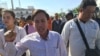 Vorn Pov, director of the development organization IDEA and a worker representative, center, shouted at authorities on Sunday as they sought to disperse the mourners, January 3rd, 2016. (Hul Reaksmey/VOA Khmer)