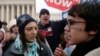FILE - A pro-choice supporter is confronted by pro-life supporters at a rally in front of the U.S. Supreme Court in Washington January 22, 2007.