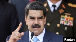 El presidente en disputa de Venezuela, Nicolás Maduro, habla durante una conferencia de prensa en el Palacio de Miraflores en Caracas, Venezuela, el 12 de marzo,de 2020.
