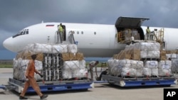 FILE - Freight is being offloaded from a plane at Mogadishu airport, in Mogadishu, Somalia, Aug. 8, 2011. Somalia is embroiled in a standoff over the confiscation from UAE diplomats at Mogadishu airport of nearly $10 million in cash whose purpose remains in dispute.
