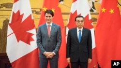 加拿大總理杜魯多(左)與中國總理李克強(右)資料照。