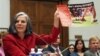 U.S. Centers for Disease Control (CDC) Director Julie Gerberding holds up a staph awareness poster while testifying before the House Committee on Oversight and Government Reform Committee hearing on drug-resistant infections and the consequences for publi