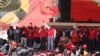 President Uhuru Kenyatta waves the Jubilee Party flag to the crowd as he launches the party he will use to run for office in 2017 polls, Sept. 10, 2016. (M. Yusuf/VOA)