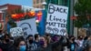 Demonstrators protest the death of George Floyd in downtown Albuquerque, N.M., May 31, 2020. 