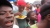 FILE - Residents of Paynesville, Liberia listen as a spokesperson for the advocacy group Crusaders for Peace educates them about the deadly ebola virus