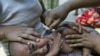 An ethnic Kachin child suffering from malaria receives treatment at a camp for people displaced by fighting between government troops and the Kachin Independence Army in northern Burma, February 22, 2012.