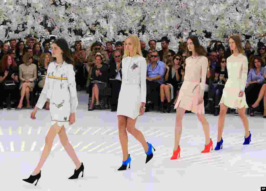 Models wear creations by Belgian fashion designer Raf Simons for Dior's Fall-Winter 2014-2015 Haute Couture fashion collection, in Paris, France.