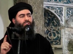 FILE - This file image made from video posted on a militant website July 5, 2014, purports to show the leader of the Islamic State group, Abu Bakr al-Baghdadi, delivering a sermon at a mosque in Iraq.