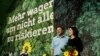 FILE - German Green Party leaders Robert Habeck and Annalena Baerbock are seen after being re-elected during the delegates' conference in Bielefeld, Germany, Nov. 16, 2019.