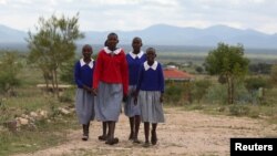 FILE - Students walk near the Imbirikani Girls High School in Imbirikani, Kenya, April 21, 2016.
