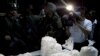 A members of the press photographs packages of seized cocaine during a drug presentation by police in Puerto Gaitan, some 150 miles southeast of Bogota, Colombia, Oct. 13, 2011.