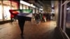 FILE - In this image taken from video, pro-Palestinian supporters march with Palestinian flags near the Ajax stadium in Amsterdam, the Netherlands, Nov. 7, 2024.