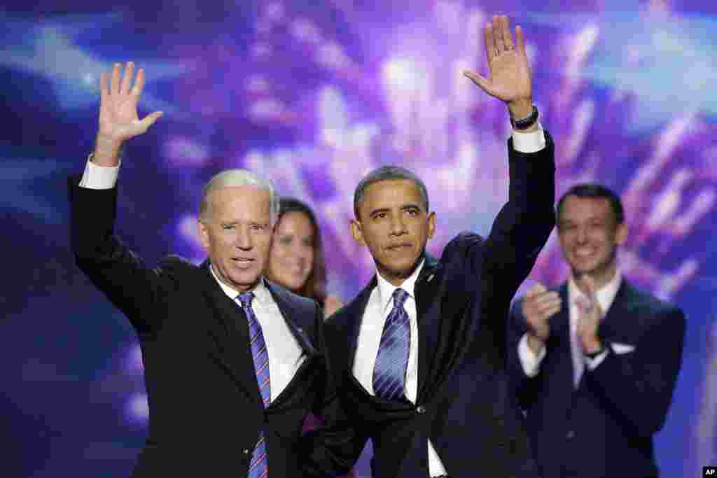 Vice President Joe Biden and President Barack Obama wave to the delegates at the conclusion of President Obama's speech at the Democratic National Convention, September 6, 2012.