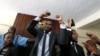 A policeman leads the handcuffed officials of the Kenya Medical Practitioners, Pharmacists and Dentist Union (KMPDU), after their case to demand fulfilment of a 2013 agreement between their union and the government, at the employment and labor relations courts in Nairobi, Kenya, Feb. 13, 2017.