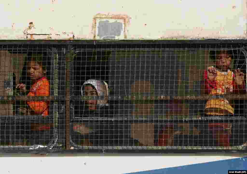 Bedouin school girls ride a bus back home from Wadi El Naam regional school in the Negev Desert, southern Israel, Feb. 13, 2007. Wadi al Naam is one of dozens of Bedouin communities not recognized by Israel.
