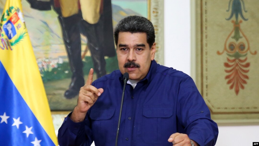 Handout picture released by the Venezuelan presidency showing Venezuelan President Nicolas Maduro speaking during a press conference at the Miraflores Presidential Palace in Caracas, Venezuela, March 11, 2019.