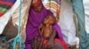 Newly displaced mother Sahra Muse, 32, comforts her malnourished child Ibrahim Ali, 7, in their makeshift shelter at a camp in the Garasbaley area on the outskirts of Mogadishu, Somalia, March 28, 2017.