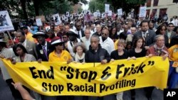 FILE - This June 17, 2012, photo shows Rev. Al Sharpton, center, with demonstrators during a silent march to end the "stop-and-frisk" program in New York.