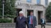 FILE - Greg Craig, former White House counsel to former President Barack Obama, left, leaves federal court in Washington, April 12, 2019.
