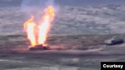 A still image from a video released by the Armenian Defence Ministry shows what is said to be Azerbaijani armoured vehicles, Nagorno-Karabakh, September 27, 2020. Defence Ministry of Armenia/Handout via REUTERS