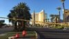 Yellow police crime scene tape blocks off area near Mandalay Bay Hotel in Las Vegas, where a gunman shot dead 59 people late Sunday, and injured 527 others. (Photo: A. Martinez / VOA)
