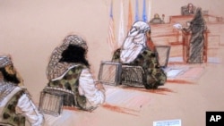 In this pool photo of a sketch by courtroom artist Janet Hamlin and reviewed by the U.S. Department of Defense, three of the five Sept. 11 defendants, from left, Ramzi Binalshibh, Walid bin Attash and the self-proclaimed terrorist mastermind Khalid Sheikh
