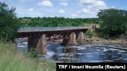 FILE - The Ruaha river water passes under a bridge in Kilolo district, Tanzania, June 14, 2017. 