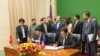 Chairman of Cambodia’s border committee, Var Kim Hong (right) and Ho Xuan Son, Vietnamese Deputy Foreign Minister sign the agreement following a three-day meeting at the Council of Ministers in Phnom Penh, Cambodia, Thursday, July 09, 2015. (Neou Vannarin/VOA Khmer)