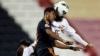 Majed Mohammed (R) of Qatar's El-Jaish fights for the ball with Nasser AlShamrani of Saudi Arabia's Al-Shabab during their AFC Champions League soccer match at the Al-Rayyan Stadium in Doha, Qatar, April 24, 2013. 
