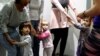 FILE - Children play in a baby-friendly cafe in Budapest, Hungary, Jan. 28, 2020. 