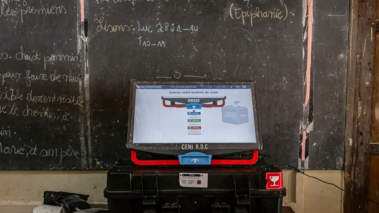 A voting machine sits on a table during a training for electoral agents from the Independent National Electoral Commission (CENI) at a voting center in Lubumbashi on December 19, 2023, on the eve of Democratic Republic of Congo's presidential and general 