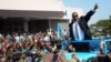 FILE - Newly elected Malawian president Peter Mutharika greets supporters after he was sworn in at the High Court in Blantyre, Malawi, May 31, 2014.