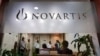 People gather at Novartis India headquarters in Mumbai April 1, 2013.
