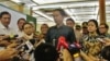 Presiden Joko Widodo memberikan penjelasan seputar penyelenggaaraan KTT Luar Biasa OKI di di Jakarta Convention Center, Jumat 4/3 (VOA/Andylala).