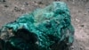 A piece of malachite, a copper ore, is seen at the bottom of Congolese state mining company Gecamines' Kamfundwa open pit copper mine, Jan. 31, 2013. 