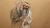 In this photo of a sketch by courtroom artist Janet Hamlin and reviewed by the U.S. Department of Defense, Khalid Sheikh Mohammed consults with his civilian attorney David Nevin during a break of his military hearing at the Guantanamo Bay U.S. Naval Base 