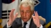 U.S. Secretary of Defense Chuck Hagel speaks to the traveling press about the U.S. government shutdown, at his hotel in Seoul, South Korea, Oct. 1, 2013.