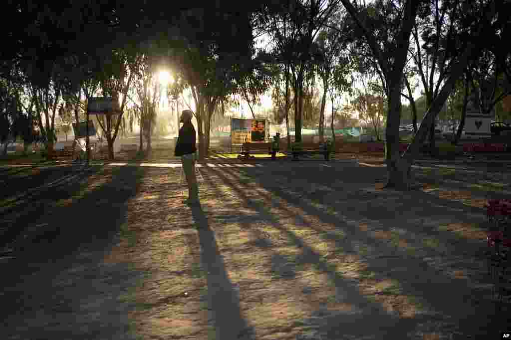 A man prays at the site of the Nova music festival, where hundreds of revelers were killed or kidnapped by Hamas, on the Jewish holiday of Simchat Torah, marking one year in the Hebrew calendar since the attack, near Kibbutz Re'im, Israel.