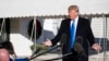 FILE - President Donald Trump speaks with reporters on the South Lawn of the White House, Dec. 7, 2019, in Washington. 