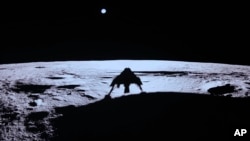 Private lunar lander Blue Ghost's shadow is seen on the moon's surface after touching down on the moon with a special delivery for NASA, Sunday, March 2, 2025. (NASA/Firefly Aerospace via AP)