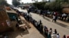 FILE - Kenyans wait to cast their vote at a polling station in Kibera slum in Nairobi March 4, 2013. 