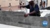 Plastic Waste Turned to Plastic Bricks to Build Schools