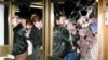FILE - Protesters storm the headquarters building of the East German Stasi secret service in what was then East Berlin, Jan. 15, 2020.