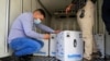 Personnel check the first shipment of the Pfizer's vaccine against the coronavirus disease (COVID-19) at Baghdad International Airport, in Baghdad, Iraq, Apr. 11, 2021. 