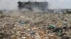 An apartment is engulfed by toxic smoke from burning trash at Dandora waste site, one of Africa's biggest garbage dumps, in Nairobi, Kenya (Oct. 5, 2007 file photo) 