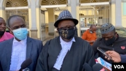 Veteran lawyer Tendai Biti, who represented Musa Kika, is seen speaking to journalists outside Zimbabwe's High Court in Harare, May 15, 2021. (Columbus Mavhunga/VOA)