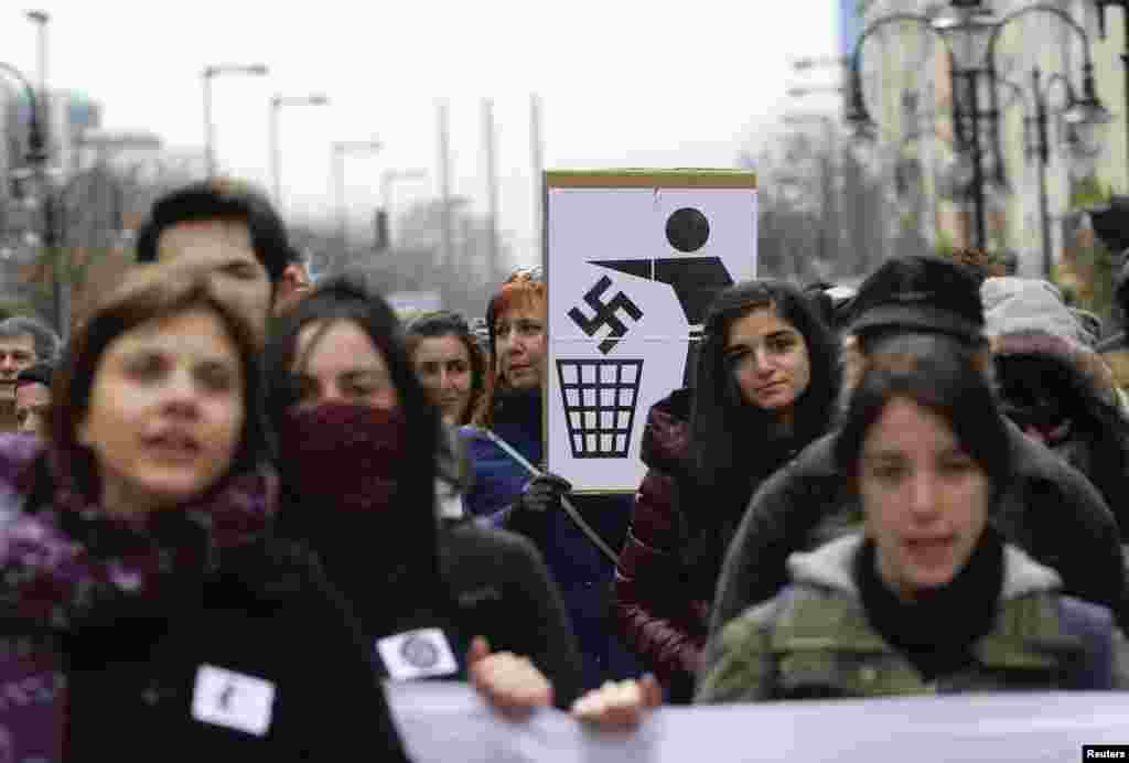 Demonstrators participate in a rally in central Sofia November 17, 2013. Several hundred people gathered in a peaceful march under the slogan "Warning! Fascism!" to protest against recent violence against refugees and migrants.
