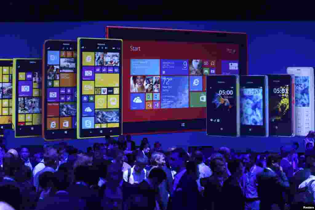 People attend a Nokia launch ceremony in Abu Dhabi, United Arab Emirates. Nokia unveiled its first tablet and two large-screen smartphones, known as phablets, at the annual Nokia World event in Abu Dhabi. 